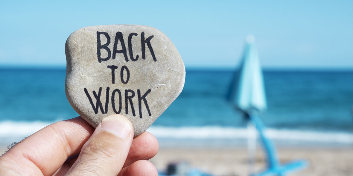 folded beach umbrella and text back to work